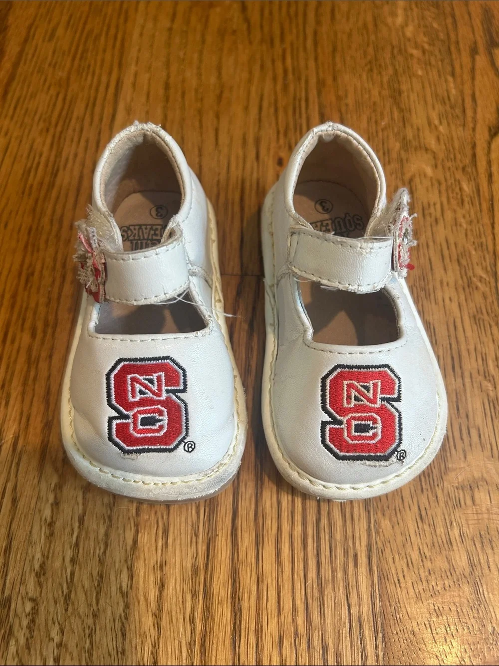 Team Squeaks Kids White Mary Jane Shoes with Red NC State Logo